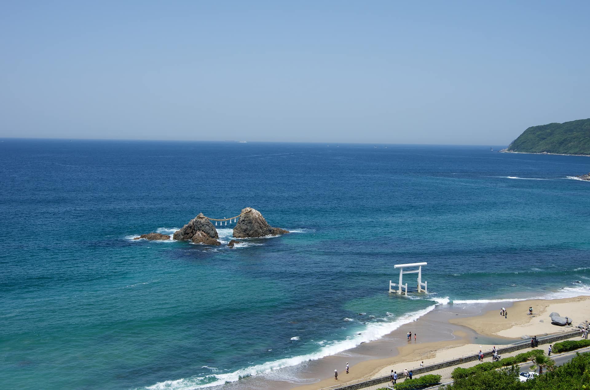 The married rocks and white torii of Sakurai Futamigaura in the turquoise sea off Itoshima
