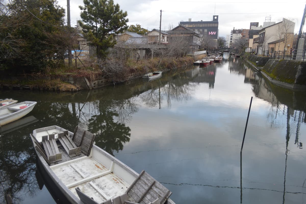 Boats moored on a quiet canal in Yanagawa